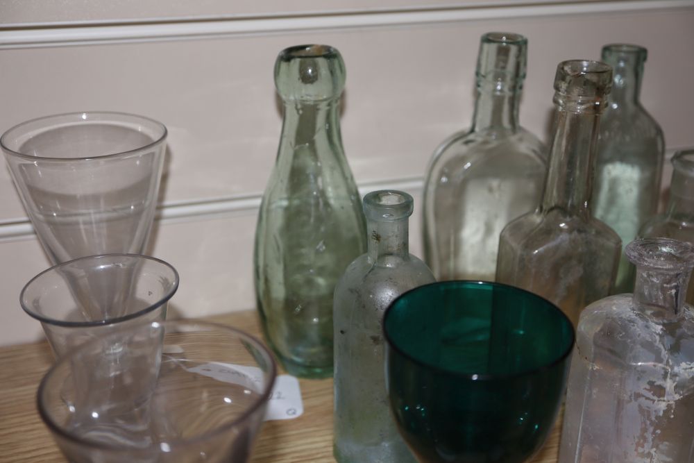 A quantity of glasses and glass bottles